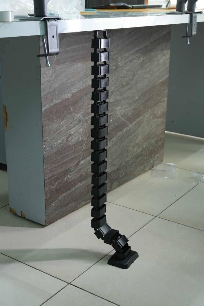 Spinal cable organizer desk routing view