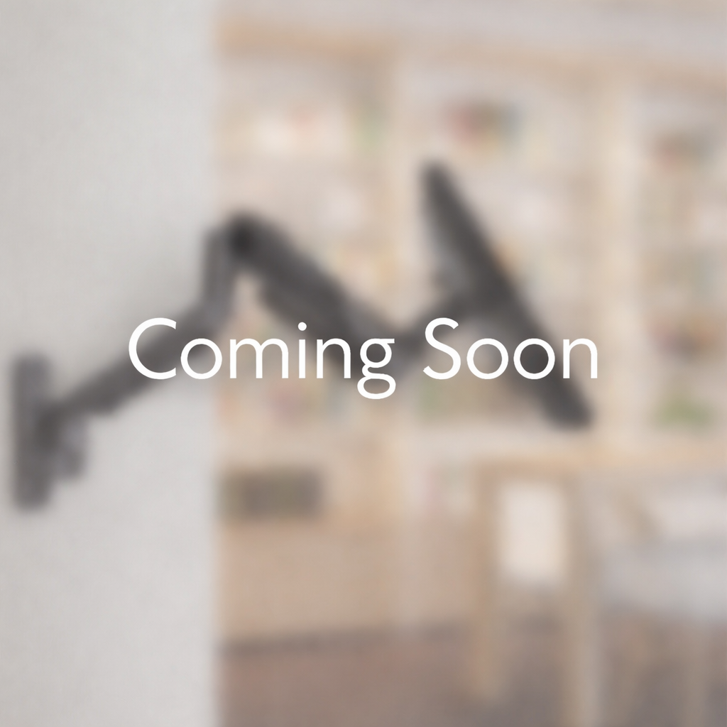 Indalio wall mount monitor arm installed on a workspace wall